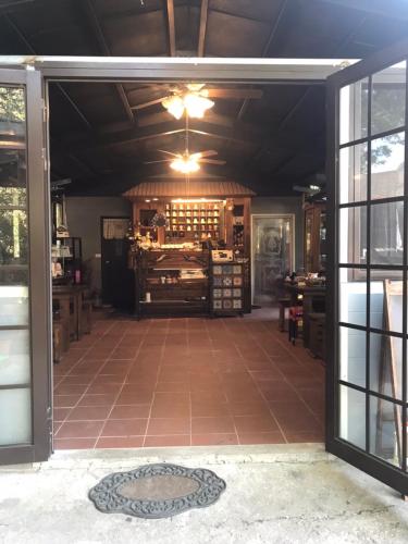 an open door to a room with a wine cellar at 薔薇谷 民宿字108號 in Fuxing