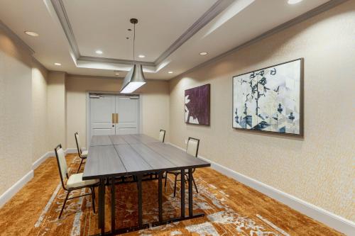 a dining room with a table and chairs at Omni New Haven Hotel at Yale in New Haven