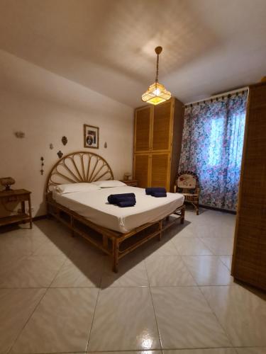 Un pat sau paturi într-o cameră la Villa Nice San Vito Lo Capo