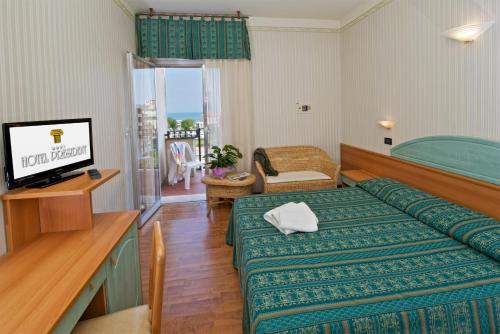 a hotel room with a bed and a television at Hotel President in Cattolica