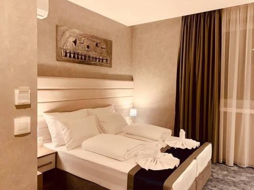 Tempat tidur dalam kamar di Hotel Stolac