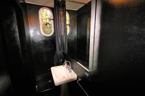 a bathroom with a white sink and a window at Villa Franca Portofino by KlabHouse in Portofino