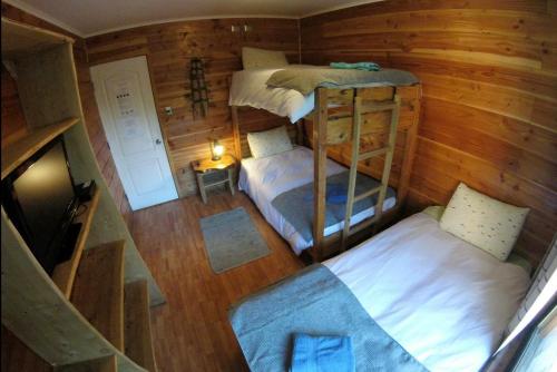 an overhead view of a room with two bunk beds at Hotel Andes Pucón in Pucón