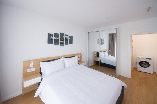Katil atau katil-katil dalam bilik di Afthonia Apartamente Mamaia Nord