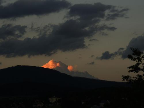 a sunset on top of a mountain under a cloudy sky at FW Zauberblick in Zwiesel