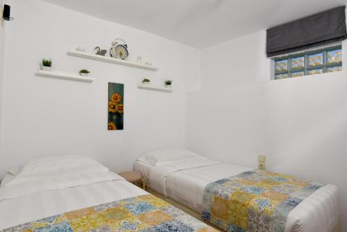 Säng eller sängar i ett rum på Villa Agia Rethymno