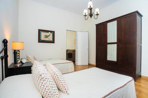 Ένα ή περισσότερα κρεβάτια σε δωμάτιο στο Casa Juana a 50 metros la playa del Reducto y wifi free