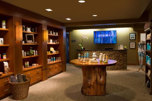 a salon with a wooden table in a room at Teton Mountain Lodge and Spa, a Noble House Resort in Teton Village
