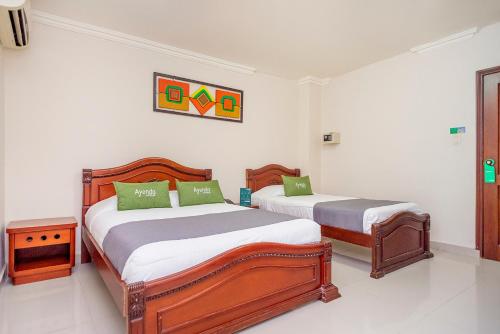 Cama o camas de una habitación en Hotel Costa Linda