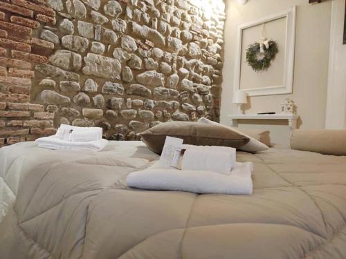 Voodi või voodid majutusasutuse Borgo in Città toas