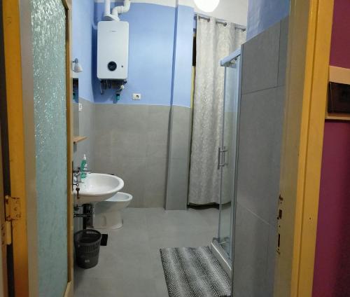 a bathroom with a shower and a toilet and a sink at traivicolidifoligno in Foligno