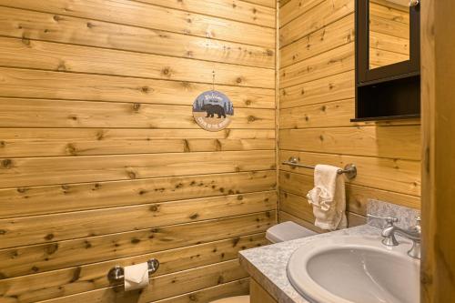 a wooden bathroom with a sink and a toilet at Wait for it Getaway in Angel Fire