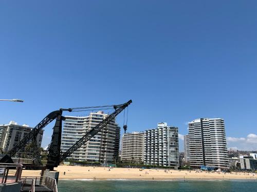 a view of a beach with tall buildings at Departamento en Playa Acapulco viña del mar in Viña del Mar