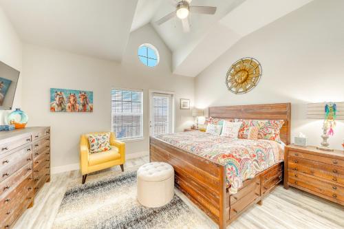 a bedroom with a wooden bed and a yellow chair at Pathway to the Sea 14816 in Padre Island