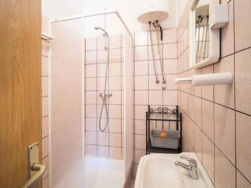 a bathroom with a shower and a sink at Apartments in Vrbnik/Insel Krk 13611 in Vrbnik