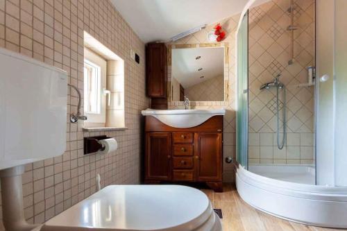 a bathroom with a toilet and a sink and a shower at Apartment in Porat/Insel Krk 13159 in Porat