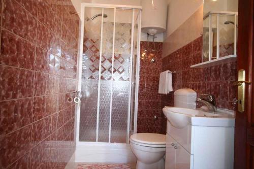 a bathroom with a shower and a toilet and a sink at Apartment in Silo/Insel Krk 13547 in Šilo