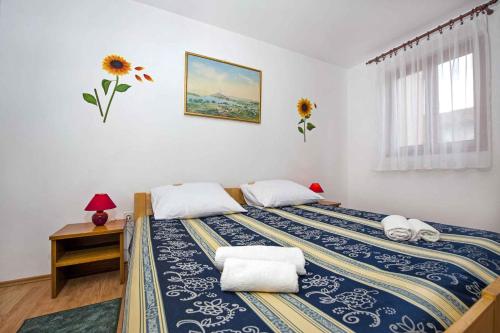 a bedroom with a bed with two pillows on it at Apartment in Rovinj/Istrien 11561 in Štanga