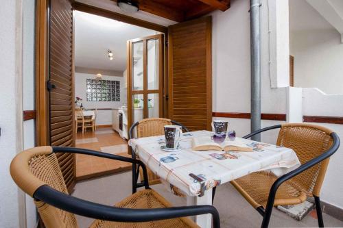 a dining room with a table and chairs at Apartment in Rovinj/Istrien 11561 in Štanga