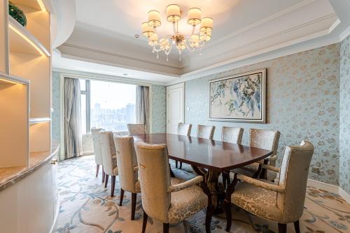 a dining room with a table and chairs at Shangri-La Wuhan,Close to The Mixc with three subway lines in Wuhan