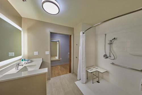 a bathroom with a sink and a shower at Holiday Inn Express & Suites - Hermiston Downtown by IHG in Hermiston