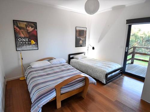 Postel nebo postele na pokoji v ubytování Magic Beach House
