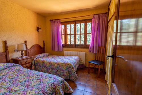 Postel nebo postele na pokoji v ubytování EVA & TRAVEL - El Bosquet de Prades