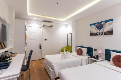 Un ou plusieurs lits dans un hébergement de l'établissement Hoang Trinh Hotel