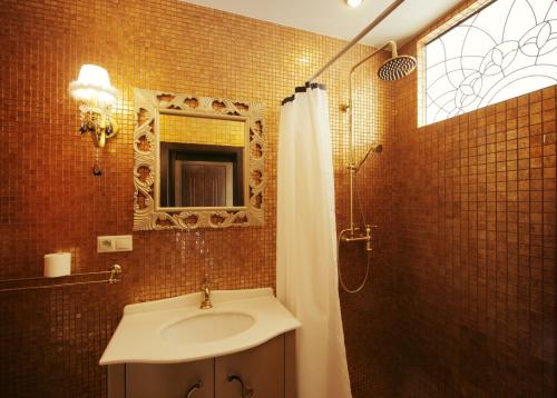 a bathroom with a sink and a shower at Garden Hotel Domaša in Domaša Dobrá