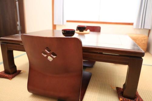 a desk with a chair with an apple logo on it at 仔鹿 kojika in Nara