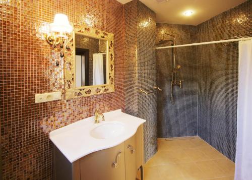a bathroom with a sink and a shower at Garden Hotel Domaša in Domaša Dobrá