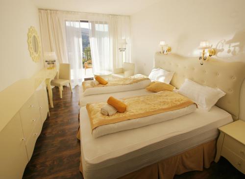Postel nebo postele na pokoji v ubytování Garden Hotel Domaša