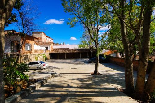 a car parked in a parking lot with trees at Real Carretero in Tapalpa