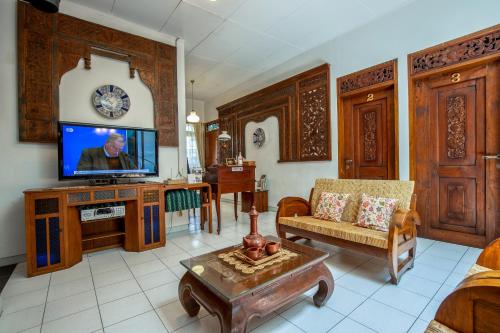 O zonă de relaxare la Sekararum Butik Syariah Guesthouse