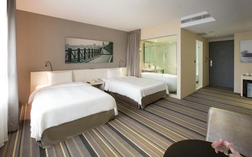 Hotelday Tamsuiにあるベッド
