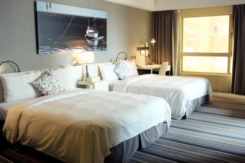 Hotelday Tamsuiにあるベッド