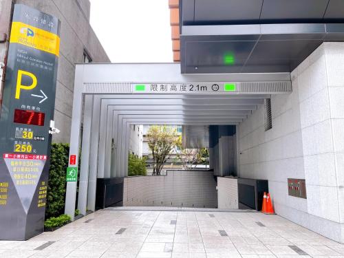 an entrance to a building with a parking garage at MGH Mitsui Garden Hotel Taipei Zhongxiao in Taipei