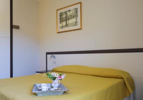 Postel nebo postele na pokoji v ubytování Hotel Fabricia