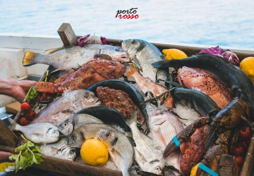 a box filled with fishes and other seafood at I Sottani in Monopoli