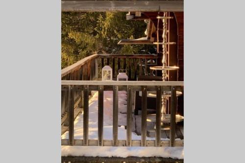 a wooden staircase with snow on the ground at Magic Ski-In-And-Out Chalet above Verbier in Bagnes