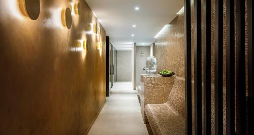a hallway with a long corridor with a hallway at Hotel Ambasador - Liburnia in Opatija