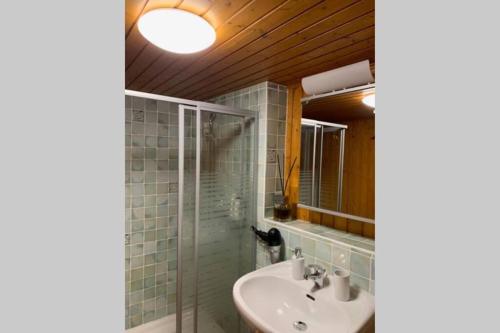 a bathroom with a sink and a mirror at Magic Ski-In-And-Out Chalet above Verbier in Bagnes