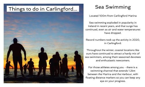 a group of people standing on the beach at sunset at Carlingford Marina Apartments in Carlingford