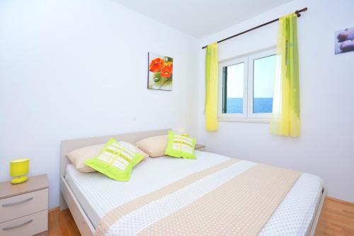 Posteľ alebo postele v izbe v ubytovaní Apartments Punta Milna