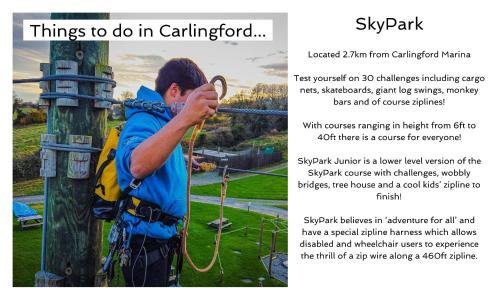 a man is tying a rope to a pole at Carlingford Marina Apartments in Carlingford