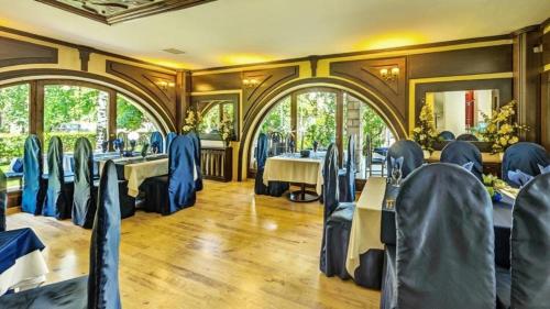 a dining car of a train with tables and chairs at Boutique Hotel L do Rado in Sofia