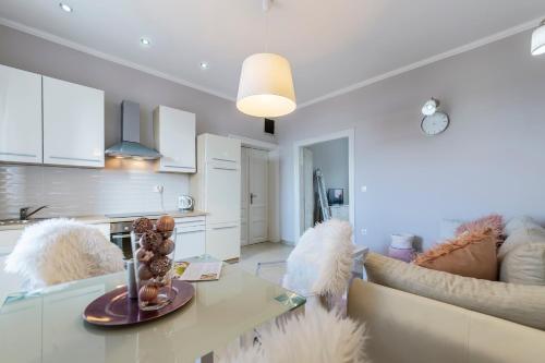 a living room with a table and a couch at Captain Emo City Apartments in Pula