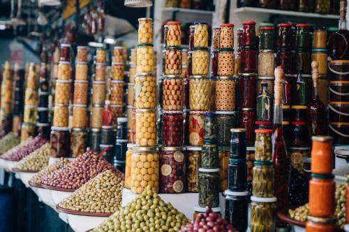 a display of different types of olives in a market at Amanjena Resort in Marrakech