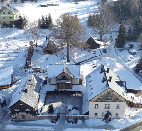 an aerial view of a village covered in snow at Ferienwohnung Zum Karzl in Sehmatal