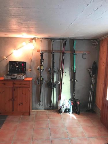 a room with a bunch of ski equipment in it at Chalet Le Biolley 2 in Orsières